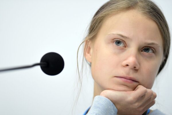 Swedish climate activist Greta Thunberg holds a press conference with other young activists to discuss the ongoing UN Climate Change Conference COP25 at the ‘IFEMA – Feria de Madrid’ exhibition centre, in Madrid, on December 9, 2019. – The COP25 summit opened on December 2 with a stark warning from the UN about the "utterly inadequate" efforts of the world’s major economies to curb carbon pollution, in Madrid, after the event’s original host Chile withdrew last month due to deadly riots over economic inequality. (Photo by CRISTINA QUICLER / AFP)