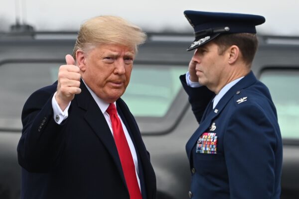 US President Donald Trump arrives to board Air Force One as he departs Joint base Andrews in Maryland on December 14, 2019, for a trip to the Army-Navy football game in Philadelphia. (Photo by Andrew CABALLERO-REYNOLDS / AFP)