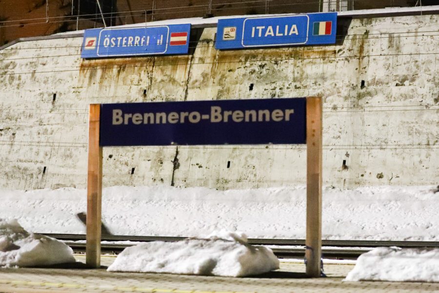 The name plaque of the Brenner train station stand at the border between Austrian and Italy at the Brenner Pass, Italy, Sunday, Feb. 23, 2020. Austria halted all train traffic to and from Italy following fears that a train on Sunday night had two people on board who may have been infected with the COVID-19 virus. (AP Photo/Matthias Schrader)