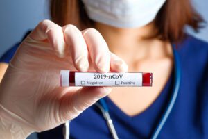 Nurse holding test tube with blood for 2019-nCoV analyzing. Novel Chinese Coronavirus blood test concept