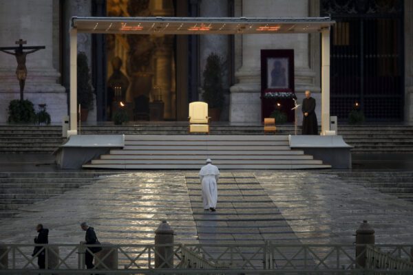 Pope Francis arrives to deliver an Urbi et orbi prayer from the empty St. Peter’s Square, at the Vatican, Friday, March 27, 2020. Praying in a desolately empty St. Peter’s Square, Pope Francis on Friday likened the coronavirus pandemic to a storm laying bare illusions that people can be self-sufficient and instead finds "all of us fragile and disoriented" and needing each other’s help and comfort. The new coronavirus causes mild or moderate symptoms for most people, but for some, especially older adults and people with existing health problems, it can cause more severe illness or death. (AP Photo/Alessandra Tarantino)