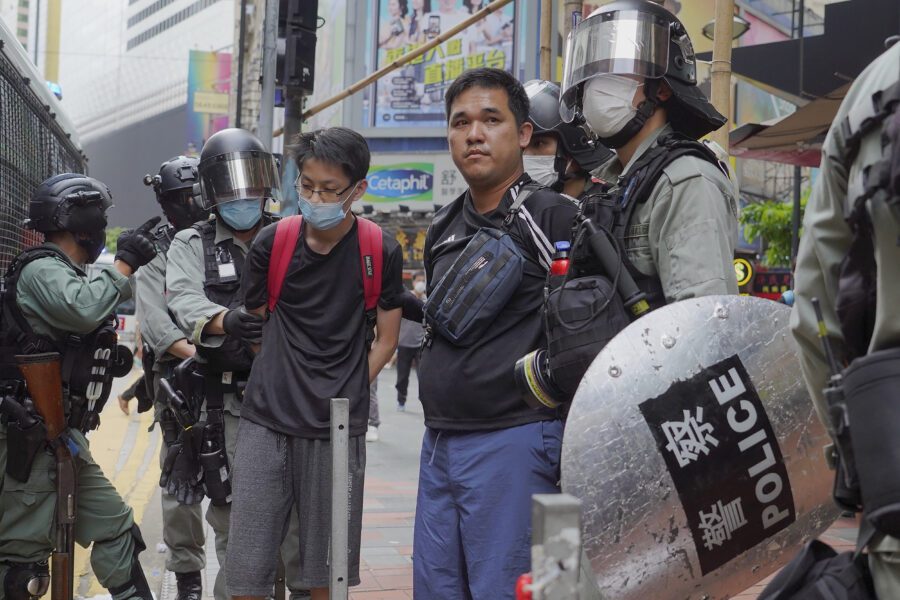 Riot police detain protesters during a demonstration against Beijing’s national security legislation in Causeway Bay in Hong Kong, Sunday, May 24, 2020. Hong Kong police fired volleys of tear gas in a popular shopping district as hundreds took to the streets Sunday to march against China’s proposed tough national security legislation for the city. (AP Photo/Vincent Yu)