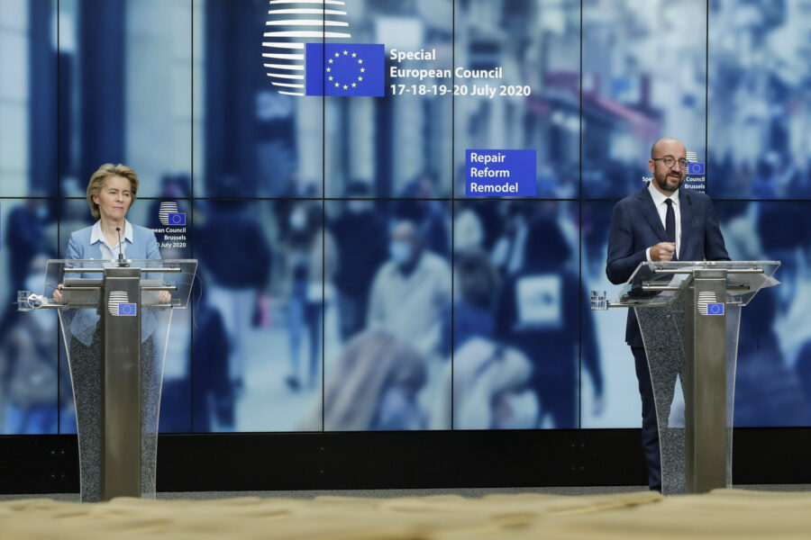 European Commission President Ursula von der Leyen, left, and European Council President Charles Michel speak during a media conference at the end of an EU summit in Brussels, Tuesday, July 21, 2020. Weary European Union leaders finally clinched an unprecedented budget and coronavirus recovery fund early Tuesday, finding unity after four days and as many nights of fighting and wrangling over money and power in one of their longest summits ever. (Stephanie Lecocq, Pool Photo via AP)