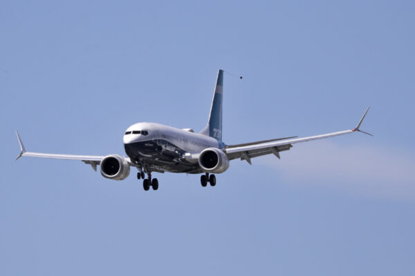 A Boeing 737 MAX jet heads to a landing at Boeing Field following a test flight Monday, June 29, 2020, in Seattle. The jet took off from Boeing Field earlier in the day, the start of three days of re-certification test flights that mark a step toward returning the aircraft to passenger service. The Federal Aviation Administration test flights over the next three days will evaluate Boeing’s proposed changes to the automated flight control system on the MAX, a system that activated erroneously on two flights that crashed, killing 346 people. (AP Photo/Elaine Thompson)