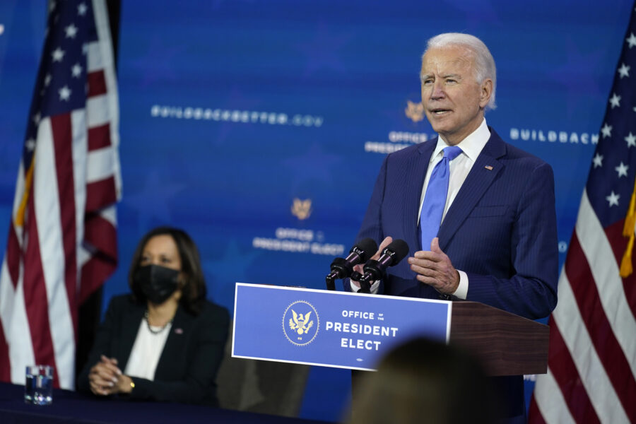 President-elect Joe Biden speaks as Vice President-elect Kamala Harris listens at left, during an event to introduce their nominees and appointees to economic policy posts at The Queen theater, Tuesday, Dec. 1, 2020, in Wilmington, Del. (AP Photo/Andrew Harnik)