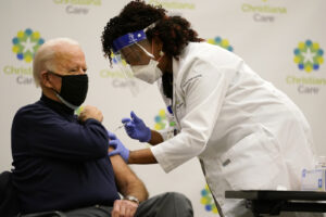 President-elect Joe Biden receives his first dose of the coronavirus vaccine at Christiana Hospital in Newark, Del., Monday, Dec. 21, 2020. (AP Photo/Carolyn Kaster)