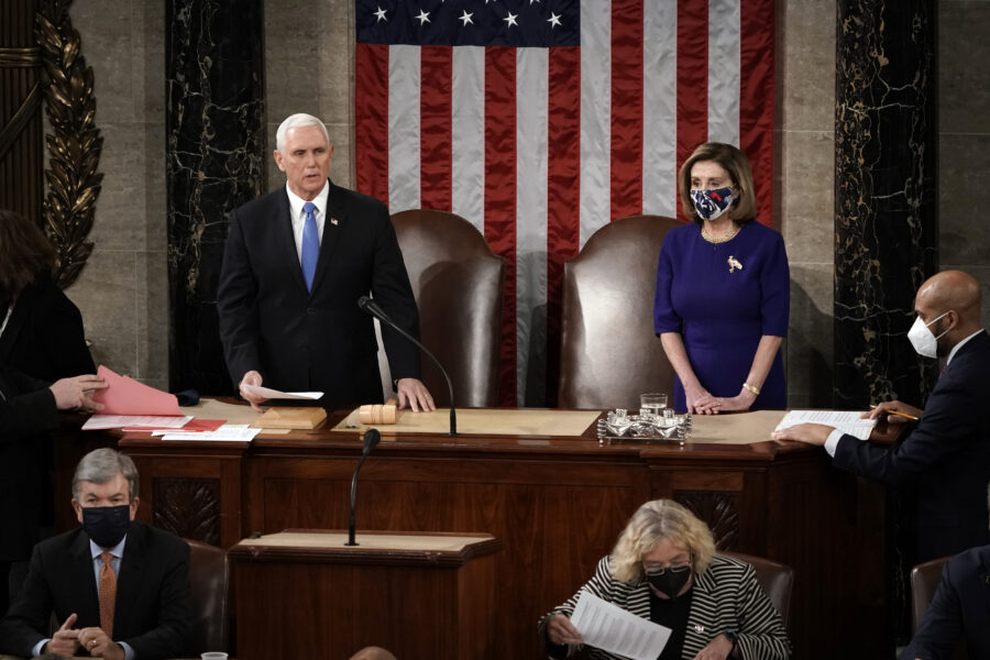 Speaker of the House Nancy Pelosi, D-Calif., and Vice President Mike Pence officiate as a joint session of the House and Senate convenes to confirm the Electoral College votes cast in November’s election, at the Capitol in Washington, Wednesday, Jan. 6, 2021. (AP Photo/J. Scott Applewhite, Pool)