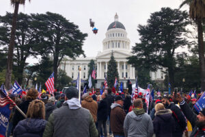 Hundreds of pro-Trump demonstraors gather outside the California Capitol building in Sacramento Wednesday, Jan. 6, 2021. Thousands of protesters nationwide are cheering President Donald Trump and his baseless claims of election fraud before Congress’ vote to affirm President-elect Joe Biden’s victory. (AP Photo/Adam Beam)