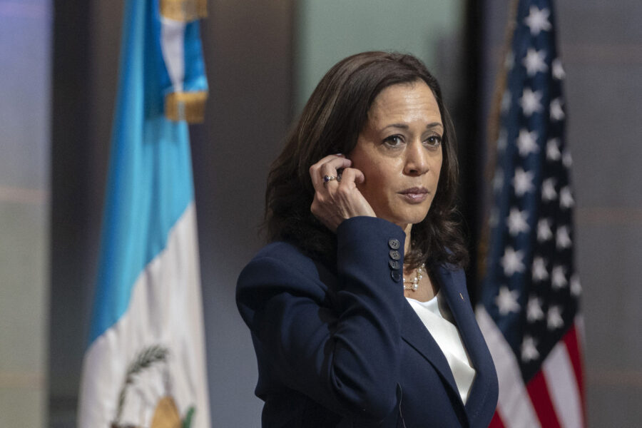 Vice President Kamala Harris removes her translation device during a news conference with Guatemalan President Alejandro Giammattei, Monday, June 7, 2021, at the National Palace in Guatemala City. (AP Photo/Jacquelyn Martin)