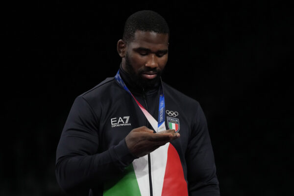 Abraham de Jesus Conyedo Ruano inspects his bronze medal during the victory ceremony for men’s freestyle 97kg wrestling at the 2020 Summer Olympics, Saturday, Aug. 7, 2021, in Chiba, Japan. (AP Photo/Aaron Favila)