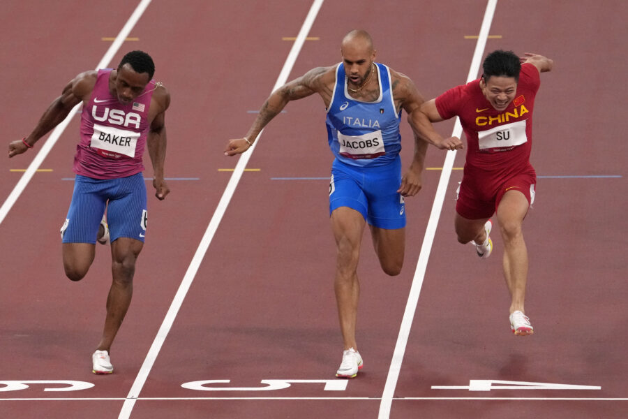 Bingtian Su, of China, right, races to win a semifinal of the men’s 100-meters ahead of Ronnie Baker, of United States, left, and Lamont Jacobs, of Italy, at the 2020 Summer Olympics, Sunday, Aug. 1, 2021, in Tokyo, Japan. (AP Photo/Charlie Riedel)