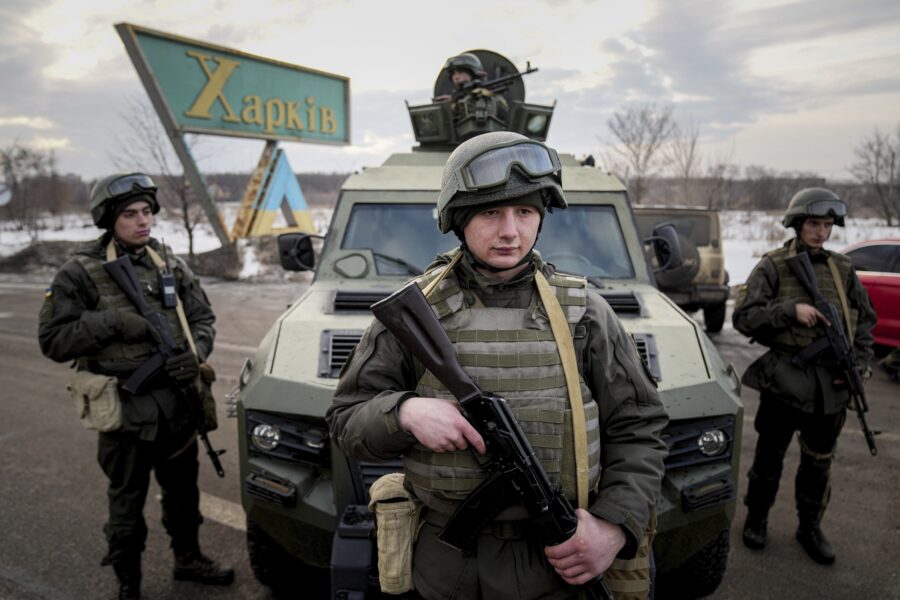 Ukrainian National guard soldiers guard a mobile checkpoint together with the Ukrainian Security Service agents and police officers during a joint operation in Kharkiv, Ukraine, Thursday, Feb. 17, 2022. Fears of a new war in Europe have resurged as U.S. President Joe Biden warned that Russia could invade Ukraine within days, and violence spiked in a long-running standoff in eastern Ukraine that some fear could be the spark for wider conflict. (AP Photo/Evgeniy Maloletka)