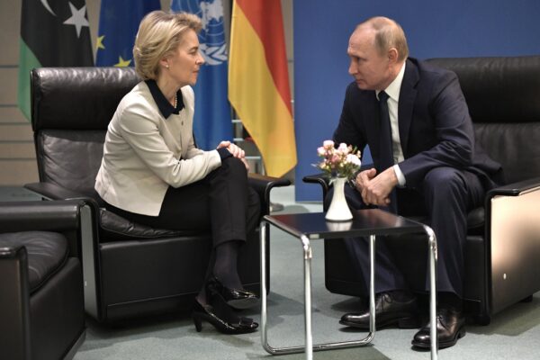 Russian President Vladimir Putin, right, and European Commission President Ursula von der Leyen talk to each other during their meeting on the sideline of a conference on Libya at the chancellery in Berlin, Germany, Sunday, Jan. 19, 2020. German Chancellor Angela Merkel hosts the one-day conference of world powers on Sunday seeking to curb foreign military interference, solidify a cease-fire and help relaunch a political process to stop the chaos in the North African nation. (Alexei Nikolsky, Sputnik, Kremlin Pool Photo via AP)