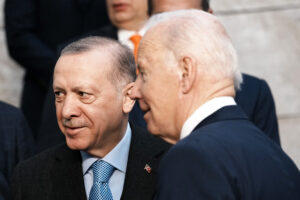 U.S. President Joe Biden, right, speaks with Turkish President Recep Tayyip Erdogan at a group photo during an extraordinary NATO summit at NATO headquarters in Brussels, Thursday, March 24, 2022. As the war in Ukraine grinds into a second month, President Joe Biden and Western allies are gathering to chart a path to ramp up pressure on Russian President Vladimir Putin while tending to the economic and security fallout that’s spreading across Europe and the world. (AP Photo/Thibault Camus)