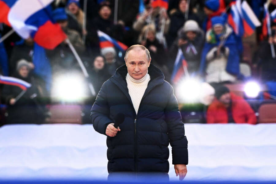Russian President Vladimir Putin delivers his speech at the concert marking the eighth anniversary of the referendum on the state status of Crimea and Sevastopol and its reunification with Russia, in Moscow, Russia, Friday, March 18, 2022. (Sergei Guneyev/Sputnik Pool Photo via AP)