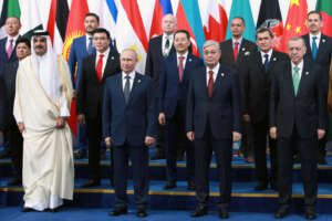 From left in front row: the Emir of Qatar, Sheikh Tamim bin Hamad Al Thani, Russian President Vladimir Putin, Kazakhstan’s President Kassym-Jomart Tokayev, and Turkey’s President Recep Tayyip Erdogan pose for a photo at the Conference on Interaction and Confidence Building Measures in Asia (CICA) summit, in Astana, Kazakhstan, Thursday, Oct. 13, 2022. (Ramil Sitdikov, Sputnik, Kremlin Pool Photo via AP)