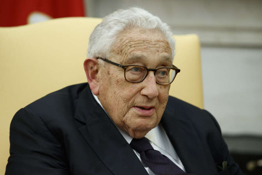 FILE – Former Secretary of State Henry Kissinger speaks during a meeting with President Donald Trump in the Oval Office of the White House, Tuesday, Oct. 10, 2017, in Washington. Kissinger marks his 100th birthday on Saturday, May 27, 2023, outlasting many of his political contemporaries who guided the United States through one of its most tumultuous periods including the presidency of Richard Nixon and the Vietnam War. (AP Photo/Evan Vucci, File)