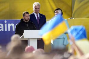 Ukraine’s President Volodymyr Zelenskyy, left, addresses the public during an event on the sidelines of a NATO summit in Vilnius, Lithuania, Tuesday, July 11, 2023. Ukrainian President Volodymyr Zelenskyy on Tuesday blasted as "absurd" the absence of a timetable for his country’s membership in NATO, injecting harsh criticism into a gathering of the alliance’s leaders that was intended to showcase solidarity in the face of Russian aggression. (AP Photo/Pavel Golovkin)