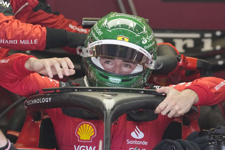 Ferrari driver Charles Leclerc of Monaco climbs out of his car following a practice session for the Formula One U.S. Grand Prix auto race at Circuit of the Americas, Friday, Oct. 20, 2023, in Austin, Texas. (AP Photo/Darron Cummings)