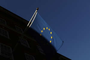 FILE – In this file photo dated Friday Jan. 22, 2021, the European Union flag flies outside Europe House in London.  Privacy campaign groups Thursday May 27, 2021, have filed a slew of legal complaints with European regulators against Clearview AI, alleging the facial recognition technology it provides to law enforcement agencies and businesses has stockpiled biometric data on more than 3 billion people without their knowledge or permission by “scraping” images from websites, breaching stringent EU privacy rules. (AP Photo/Alastair Grant, FILE)