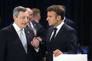 French President Emmanuel Macron, right, speaks with Italian Prime Minister Mario Draghi during a round table meeting at a NATO summit in Madrid, Spain on Wednesday, June 29, 2022. North Atlantic Treaty Organization heads of state meet for a NATO summit in Madrid from Tuesday through Thursday. (AP Photo/Manu Fernandez)
