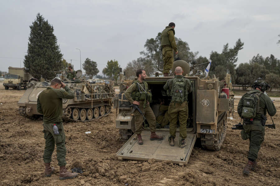 Israeli soldiers are seen at a staging area near the Israeli-Gaza border, in southern Israel, Thursday, Dec. 28, 2023. The army is battling Palestinian militants across Gaza in the war ignited by Hamas’ Oct. 7 attack into Israel. (AP Photo/Ohad Zwigenberg)