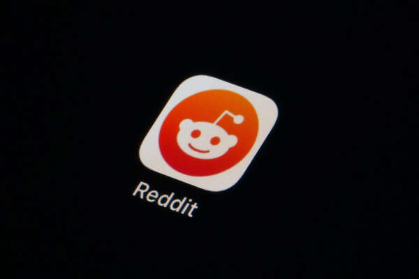 The Reddit app icon is seen on a smartphone, Tuesday, Feb. 28, 2023, in Marple Township, Pa. Reddit is facing an ongoing blackout from some of its most active users. After outrage erupted over plans to charge some third party apps for API, thousands of communities within the online discussion network went dark this week — and many organizers say their protest is not over.  (AP Photo/Matt Slocum)