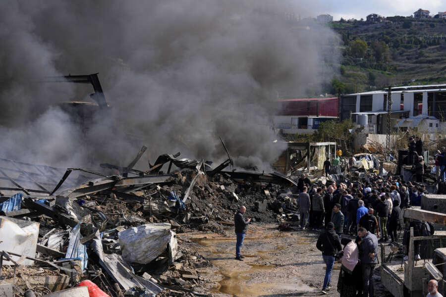 People gather at a destroyed warehouse that was attacked on Monday by Israeli airstrikes, at an industrial district in the southern coastal town of Ghazieh, Lebanon, Tuesday, Feb. 20, 2024. Israeli warplanes carried out at least two strikes near the southern port city of Sidon in one of the largest attacks near a major city, wounding a dozen of people, Lebanese state media said. (AP Photo/Bilal Hussein) 



Associated Press/ LaPresse
Only italy and Spain