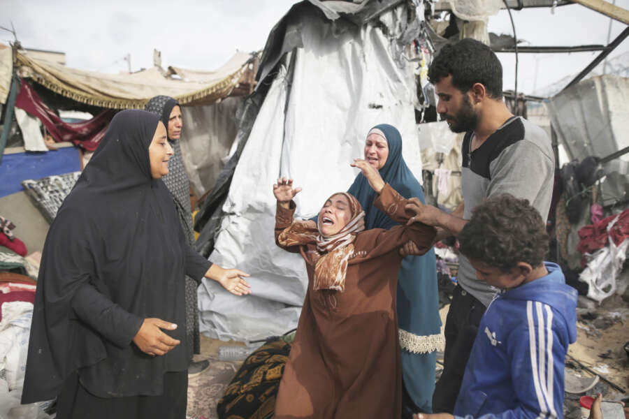 Displaced Palestinians inspect their tents destroyed by Israel’s bombardment, adjunct to an UNRWA facility west of Rafah city, Gaza Strip, Tuesday, May 28, 2024. (AP Photo/Jehad Alshrafi)