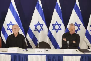 Israeli Prime Minister Benjamin Netanyahu and Cabinet Minister Benny Gantz during a press conference in the Kirya military base in Tel Aviv, Israel, Saturday, Oct. 28, 2023. (Abir Sultan/Pool Photo via AP)