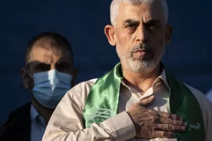 FILE – Yahya Sinwar, Palestinian leader of Hamas in the Gaza Strip, places his hand over his heart on stage after greeting supporters at a rally on May 24, 2021, in Gaza City, the Gaza Strip. (AP Photo/John Minchillo, File)