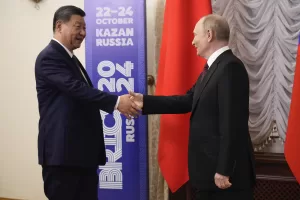 Russian President Vladimir Putin, right, and Chinese President Xi Jinping shake hands on the sidelines of BRICS Summit at Kazan Kremlin in Kazan, Russia, Tuesday, Oct. 22, 2024. (AP Photo/Alexander Zemlianichenko, Pool)