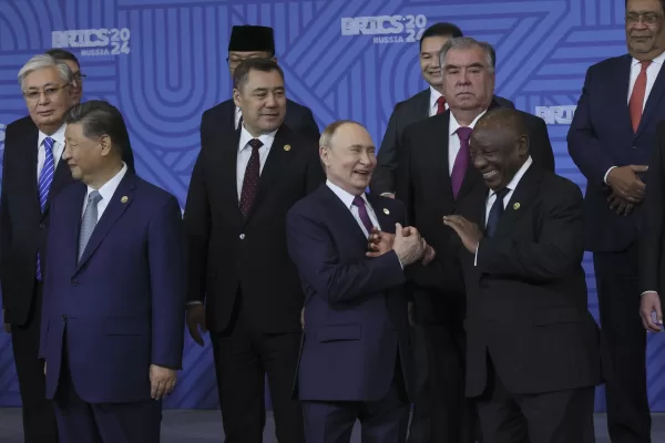 Russian President Vladimir Putin, center, and South African President Cyril Ramaphosa laugh during a family photo ceremony prior to Outreach/BRICS Plus format session at BRICS Summit in Kazan, Russia, Thursday, Oct. 24, 2024. (Maxim Shipenkov, Pool Photo via AP)