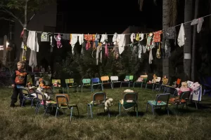 A child plays next to an art installation depicting children hostages held by Hamas in the Hostages Square at the Museum of Art in Tel Aviv, Israel, Wednesday, Nov. 29, 2023. International mediators on Wednesday worked to extend the truce in Gaza, encouraging Hamas militants to keep freeing hostages in exchange for the release of Palestinian prisoners and further relief from Israel’s air and ground offensive.(AP Photo/Maya Alleruzzo)