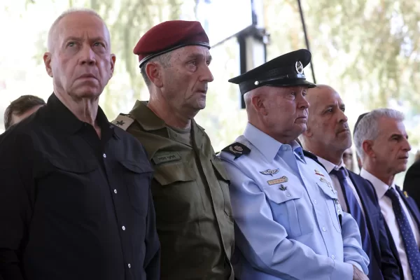 From left, Israel’s Defense Minister Yoav Gallant, Chief of the General Staff Lieutenant-General Herzi Halevi, interim Police Chief Avshalom Peled and the Director the Security Agency Ronen Bar, attend a ceremony marking the Hebrew calendar anniversary of the Hamas attack on October 7 last year, at the Mount Herzl military cemetery in Jerusalem, Israel Sunday Oct. 27, 2024. (Gil Cohen-Magen/Pool Photo via AP)