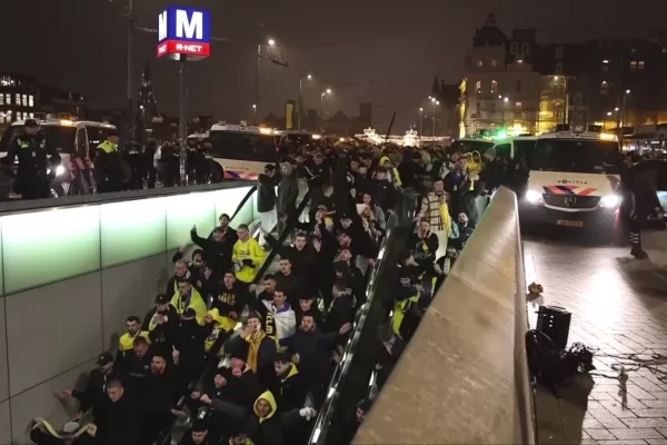 In this image taken from video, police escort Maccabi Tel Aviv supporters to the metro, after pro-Palestinian supporters marched near the soccer stadium, in Amsterdam, the Netherlands, Thursday, Nov. 7, 2024. (AP Photo InterVision)